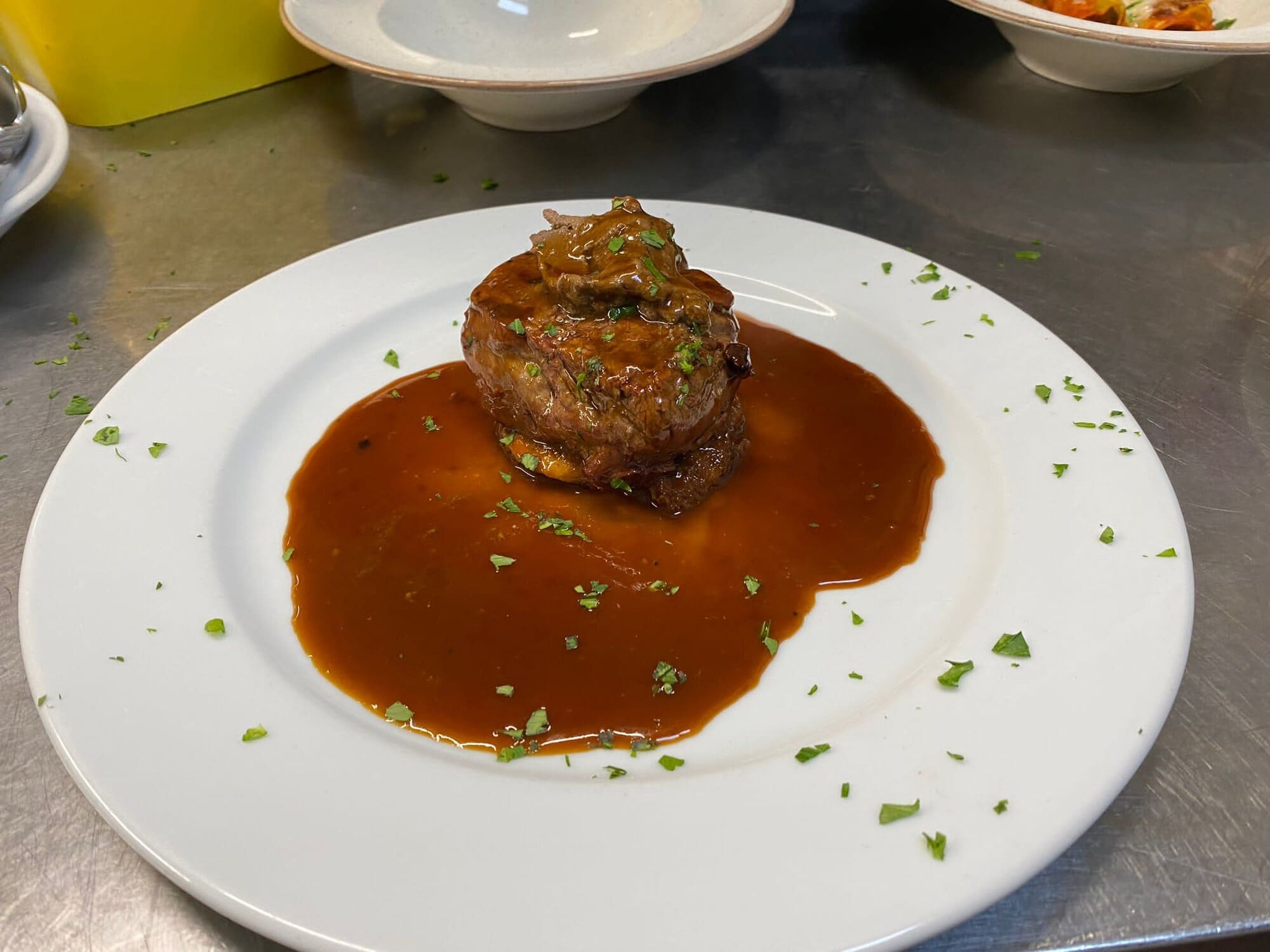 Filetto Rossini — fillet steak on toasted bread with pâté and a rich Madeira red wine sauce — at Fabio's Italian Restaurant in Swindon